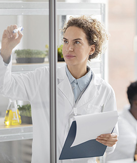 female-researcher-biotechnology-laboratory-with-clipboard